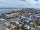 Aerial view of a home near the water, featuring a private pool and landscaping at 306 55Th St, Holmes Beach, FL 34217