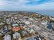 Aerial view showing a beachfront home with a private pool and tropical landscaping at 306 55Th St, Holmes Beach, FL 34217