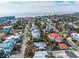 Aerial view of a single-Gathering home with a private pool, surrounded by other homes at 306 55Th St, Holmes Beach, FL 34217