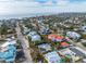 An aerial view of a single Gathering home near the beach, with a pool and tropical landscaping at 306 55Th St, Holmes Beach, FL 34217