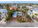 Aerial view of a single-Gathering home with a private pool and lush landscaping at 306 55Th St, Holmes Beach, FL 34217