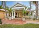 Charming tropical home with a covered porch and brick walkway at 306 55Th St, Holmes Beach, FL 34217