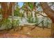 Peaceful hammock area with gravel ground cover and lush landscaping at 306 55Th St, Holmes Beach, FL 34217