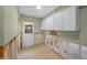 Unfinished laundry room with new white cabinets at 306 55Th St, Holmes Beach, FL 34217