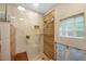 New shower with marble tile and glass enclosure at 306 55Th St, Holmes Beach, FL 34217