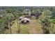 Aerial view of a house with a large fenced yard, perfect for horses at 3340 Ulman Ave, North Port, FL 34286