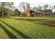 Long-range view of barn with attached shed at 3340 Ulman Ave, North Port, FL 34286