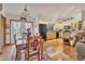 Open dining room adjacent to kitchen with wood table and chairs at 3340 Ulman Ave, North Port, FL 34286