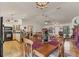 Dining area with wood table and chairs, view into kitchen at 3340 Ulman Ave, North Port, FL 34286