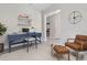 Home office with a blue desk, brown chair, and built-in shelving at 3415 Nadasky Ave, North Port, FL 34288