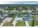 Wide aerial showcasing the home's waterfront location and neighborhood at 3438 Yukon Dr, Port Charlotte, FL 33948