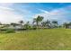 Waterfront property with lush lawn and canal views at 3438 Yukon Dr, Port Charlotte, FL 33948