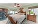 Bright bedroom featuring a comfortable bed, built-in desk, and ceiling fan at 3438 Yukon Dr, Port Charlotte, FL 33948