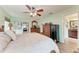 Spacious bedroom with ceiling fan, large bed, and ample dresser space at 3438 Yukon Dr, Port Charlotte, FL 33948