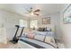 Guest bedroom with a full-size bed and a treadmill at 3438 Yukon Dr, Port Charlotte, FL 33948