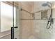 Updated shower with tiled walls and glass door at 3438 Yukon Dr, Port Charlotte, FL 33948