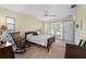 Relaxing bedroom with a rocking chair, access to the pool area, and neutral tones for a serene ambiance at 3501 Sunbeam Dr, Sarasota, FL 34240