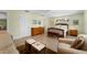 Bright bedroom with a large bed, a dresser, two nightstands, and a sitting area at 3501 Sunbeam Dr, Sarasota, FL 34240