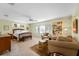 Relaxing bedroom featuring natural light, a ceiling fan, sitting area, and view to the outside at 3501 Sunbeam Dr, Sarasota, FL 34240