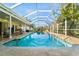 Screened pool with a patio area, perfect for relaxation and entertainment in a private outdoor space at 3501 Sunbeam Dr, Sarasota, FL 34240