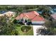 Single-Gathering home with tile roof, landscaping and driveway at 3716 Eagle Hammock Dr, Sarasota, FL 34240