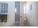 Bathroom with toilet, shower, and window for natural light at 3716 Eagle Hammock Dr, Sarasota, FL 34240