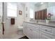 Well-lit bathroom with shower/tub combo and updated vanity at 3716 Eagle Hammock Dr, Sarasota, FL 34240