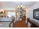 Open dining room with view into living room and wet bar area at 3716 Eagle Hammock Dr, Sarasota, FL 34240