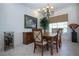 Formal dining room with chandelier and hardwood table, seats six at 3716 Eagle Hammock Dr, Sarasota, FL 34240