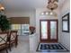 Bright and airy entryway with double doors and view into dining area at 3716 Eagle Hammock Dr, Sarasota, FL 34240