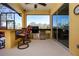 Outdoor kitchen with stainless steel appliances and bar seating at 3716 Eagle Hammock Dr, Sarasota, FL 34240