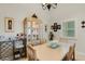 Bright dining room features a light wood table and decorative china cabinet at 3815 59Th W Ave # 3815, Bradenton, FL 34210