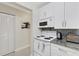 White kitchen with granite countertops and stainless steel appliances at 3815 59Th W Ave # 3815, Bradenton, FL 34210