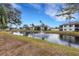 Tranquil pond with fountain, reflecting buildings and lush landscaping at 3815 59Th W Ave # 3815, Bradenton, FL 34210