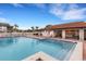 Community pool with lounge chairs and covered seating area at 3815 59Th W Ave # 3815, Bradenton, FL 34210