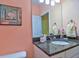 Bathroom with granite countertop, sink, and a seashell-themed picture at 3906 Chaucer Ln, Sarasota, FL 34241