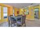 Dining area with teal table and gray chairs near kitchen at 3906 Chaucer Ln, Sarasota, FL 34241