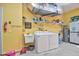 Laundry room with washer, dryer, and utility sink at 3906 Chaucer Ln, Sarasota, FL 34241