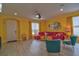 Living room with red sectional sofa and yellow walls at 3906 Chaucer Ln, Sarasota, FL 34241