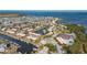 Wide aerial view of waterfront community, tennis courts and boat docks at 4009 Catalina Dr # 178, Bradenton, FL 34210