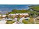 Aerial view of townhomes featuring private driveways and waterfront location at 4009 Catalina Dr # 178, Bradenton, FL 34210