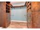 Walk-in closet with custom built-in shelving at 4009 Catalina Dr # 178, Bradenton, FL 34210