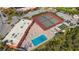 Aerial view showcases community amenities including a pool, tennis court, and shuffleboard at 4009 Catalina Dr # 178, Bradenton, FL 34210