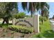 Palma Sola Harbour Condominium entrance sign amidst manicured landscaping and lush greenery at 4009 Catalina Dr # 178, Bradenton, FL 34210