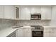 Updated kitchen featuring stainless steel appliances and white cabinets at 4009 Catalina Dr # 178, Bradenton, FL 34210