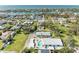 Aerial view showcasing a light blue house, pool, and surrounding neighborhood at 401 Shore Rd, Nokomis, FL 34275