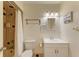 Updated bathroom with shower/tub combo at 401 Shore Rd, Nokomis, FL 34275