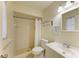 Clean bathroom with shower/tub combo and white vanity at 401 Shore Rd, Nokomis, FL 34275