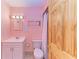 Clean bathroom with shower, toilet, and vanity at 401 Shore Rd, Nokomis, FL 34275