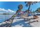 Picnic tables outside a waterfront bar at 401 Shore Rd, Nokomis, FL 34275